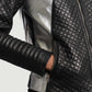 Detail of the luxurious quilted viscose lining inside the black biker jacket.