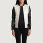 Three-quarter view of the silver and black leather varsity bomber jacket, highlighting its athletic silhouette and sleek zipper closure.