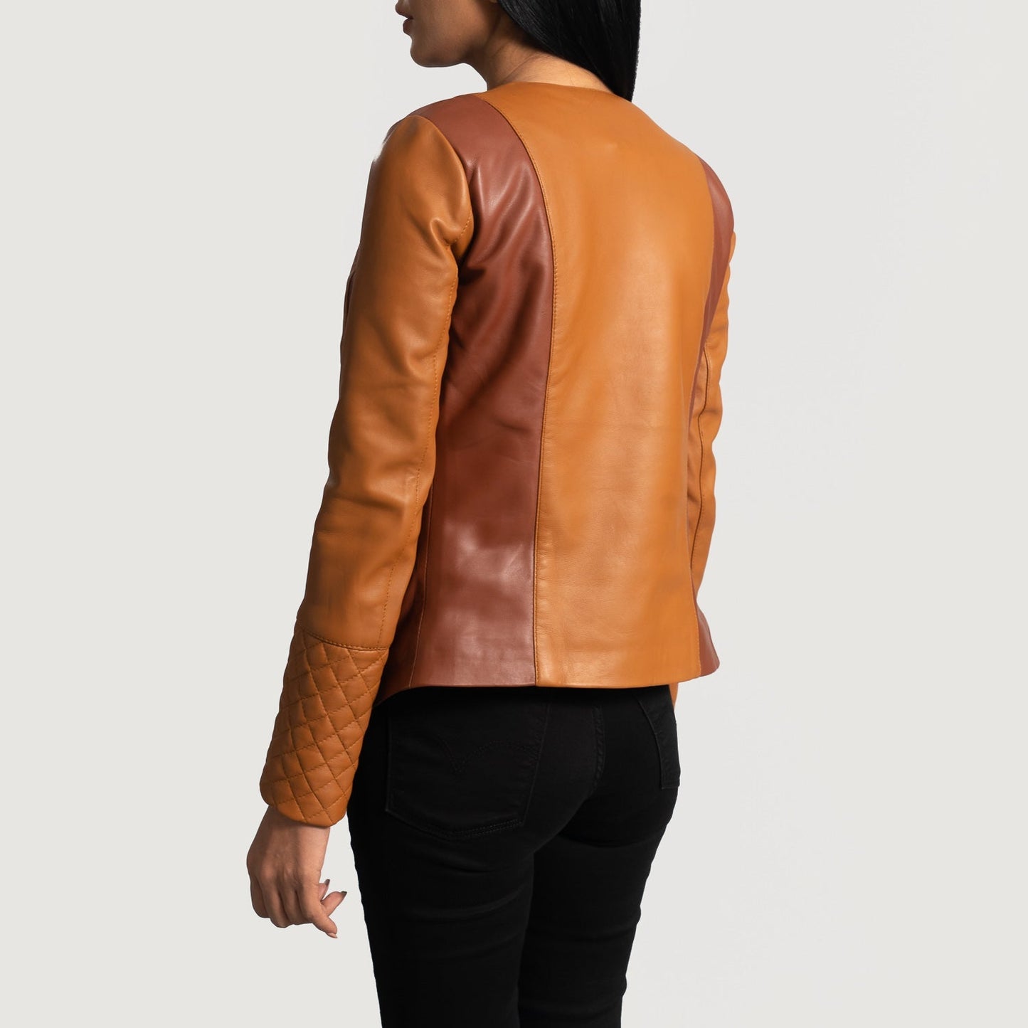 Detail of the luxurious quilted viscose lining inside the tan leather coat.