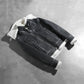 Close up of the high neck collar design featuring belt buckle hardware.