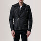 Black leather jacket worn by a person on a plain background