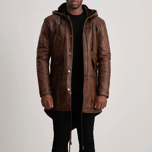 Man wearing a brown leather coat on a plain background