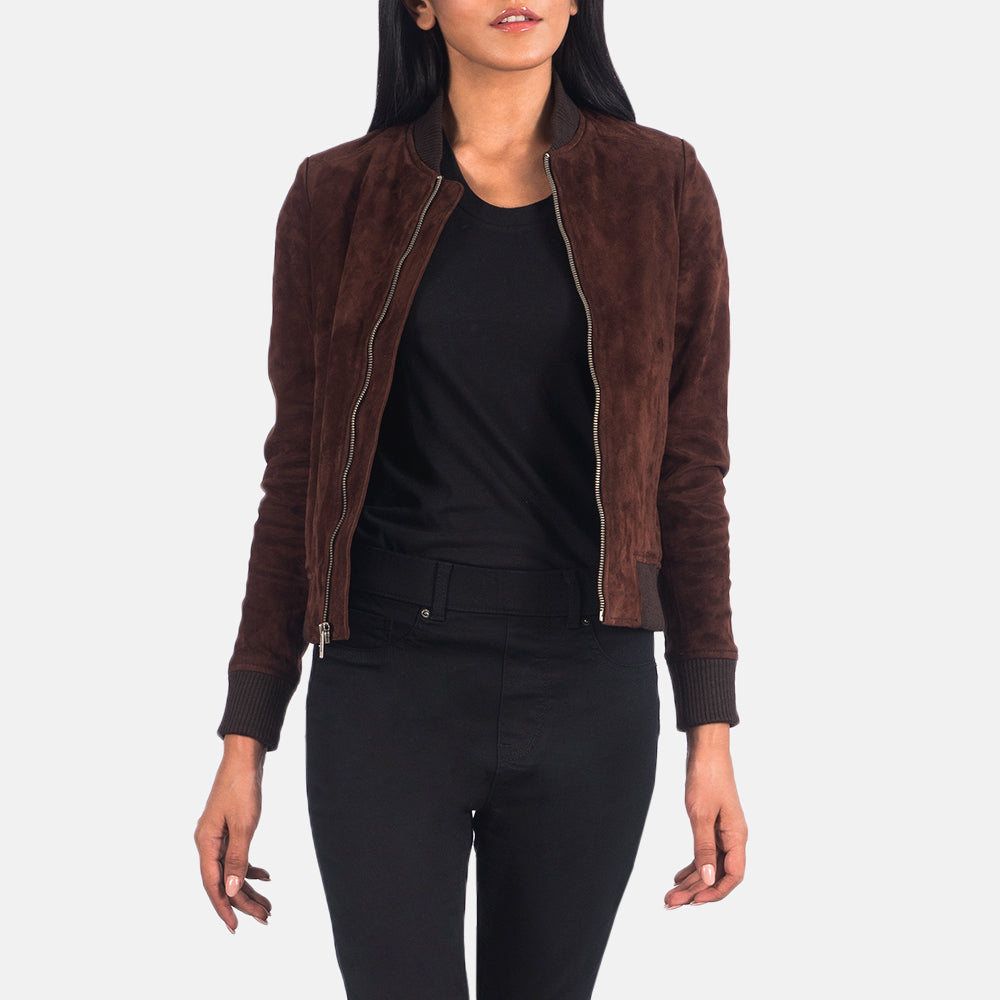 Cinematic side-angle view of the brown suede bomber jacket, capturing the rich earthy tones of the hide under soft, dappled lighting.