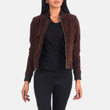 Cinematic side-angle view of the brown suede bomber jacket, capturing the rich earthy tones of the hide under soft, dappled lighting.