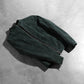 View of the two functional exterior pockets on the front of the suede jacket.
