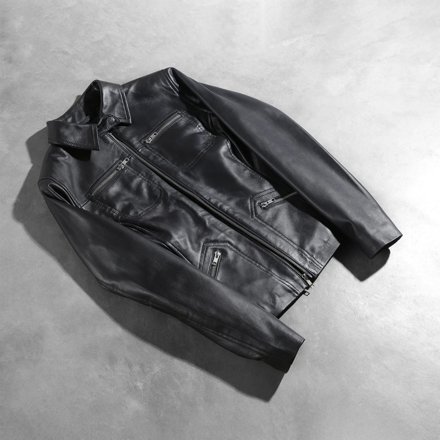 View of the four functional exterior pockets on the front of the black leather.