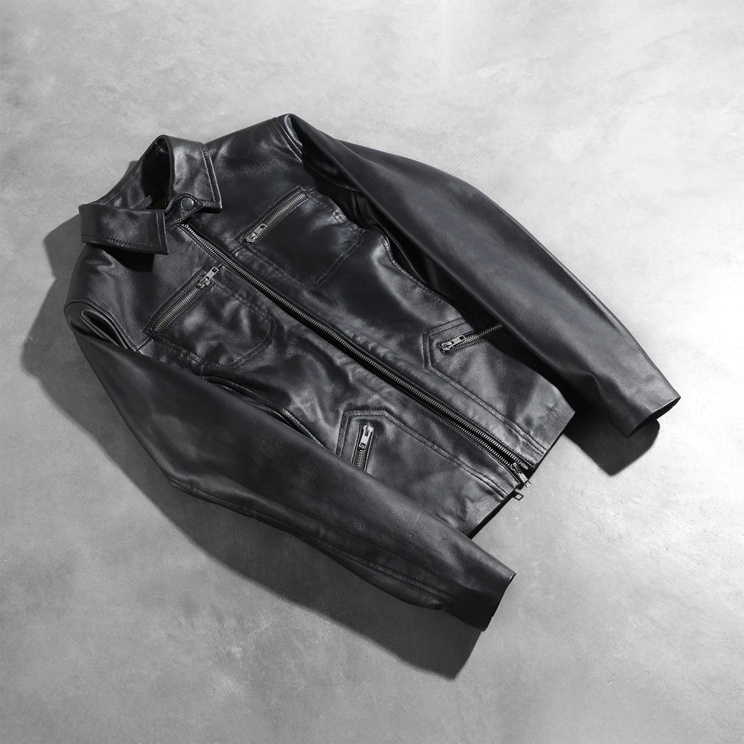 View of the four functional exterior pockets on the front of the black leather.