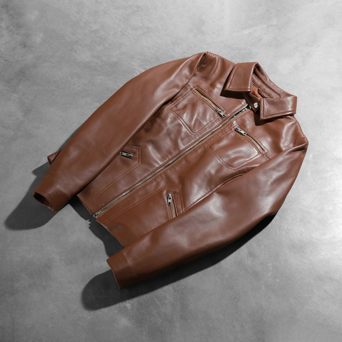 Close up showing the clean open hem cuff design on the sleeves.