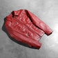 Detail of the secure interior storage pockets inside the red leather jacket.