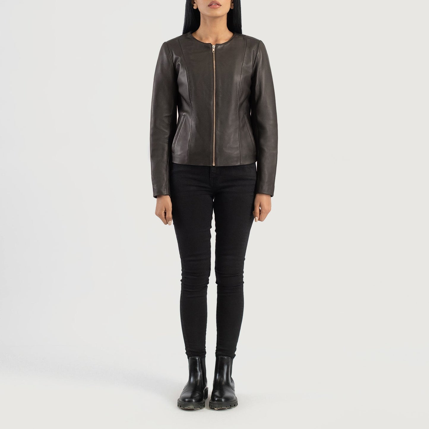 Three quarter profile view of the brown collarless jacket, highlighting its streamlined, minimalist silhouette and tailored fit.