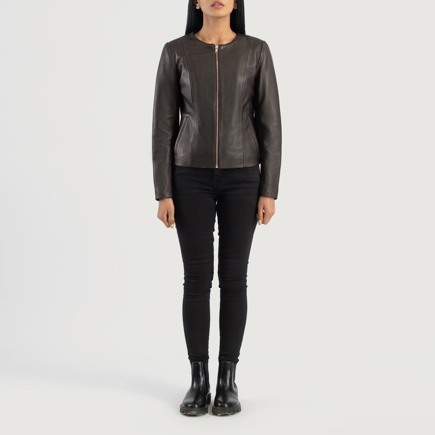 Three quarter profile view of the brown collarless jacket, highlighting its streamlined, minimalist silhouette and tailored fit.