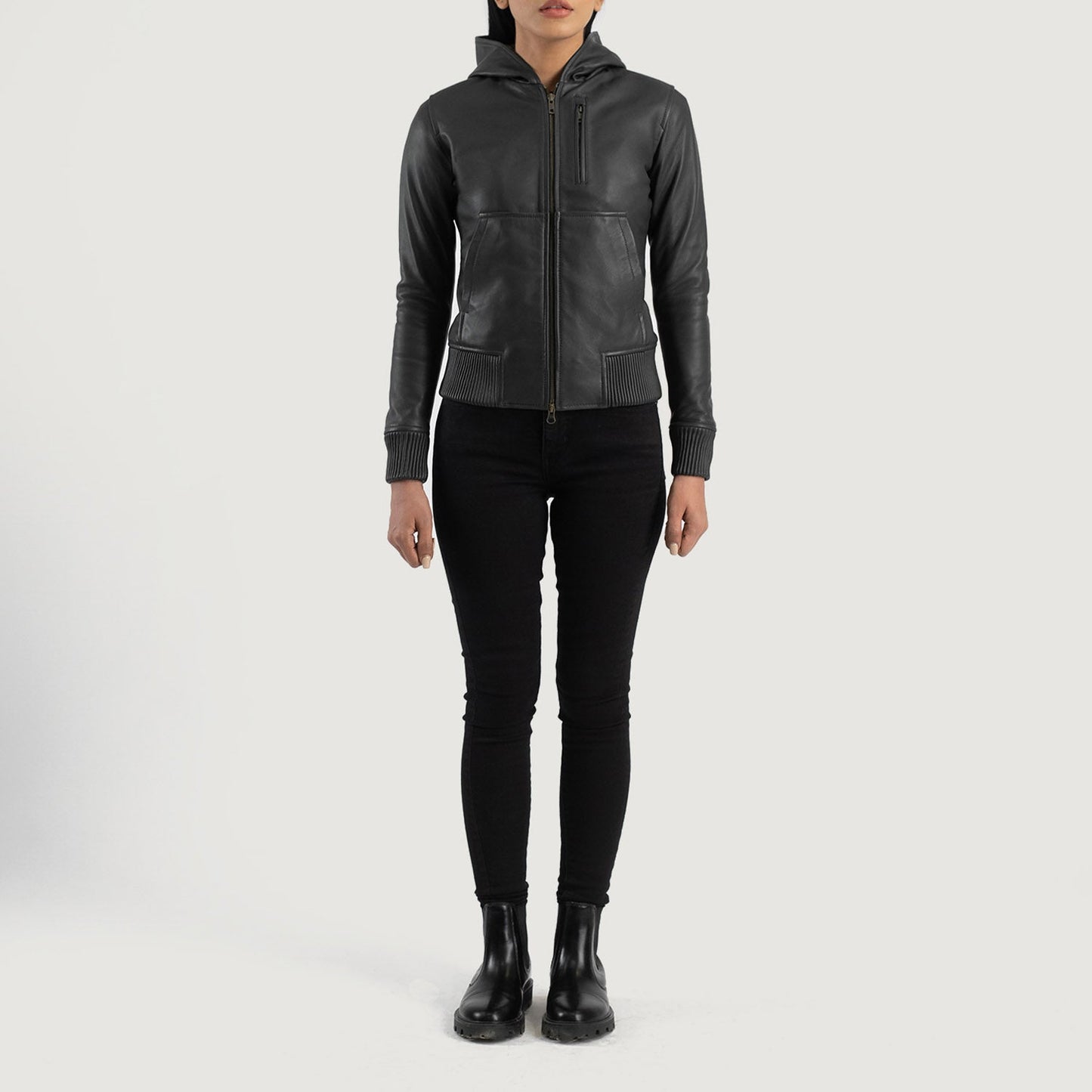 Three quarter profile view of the black hooded leather jacket, highlighting its relaxed athletic silhouette and comfortable fit.