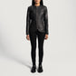 Close up of premium black aniline sheepskin leather texture on a jacket.