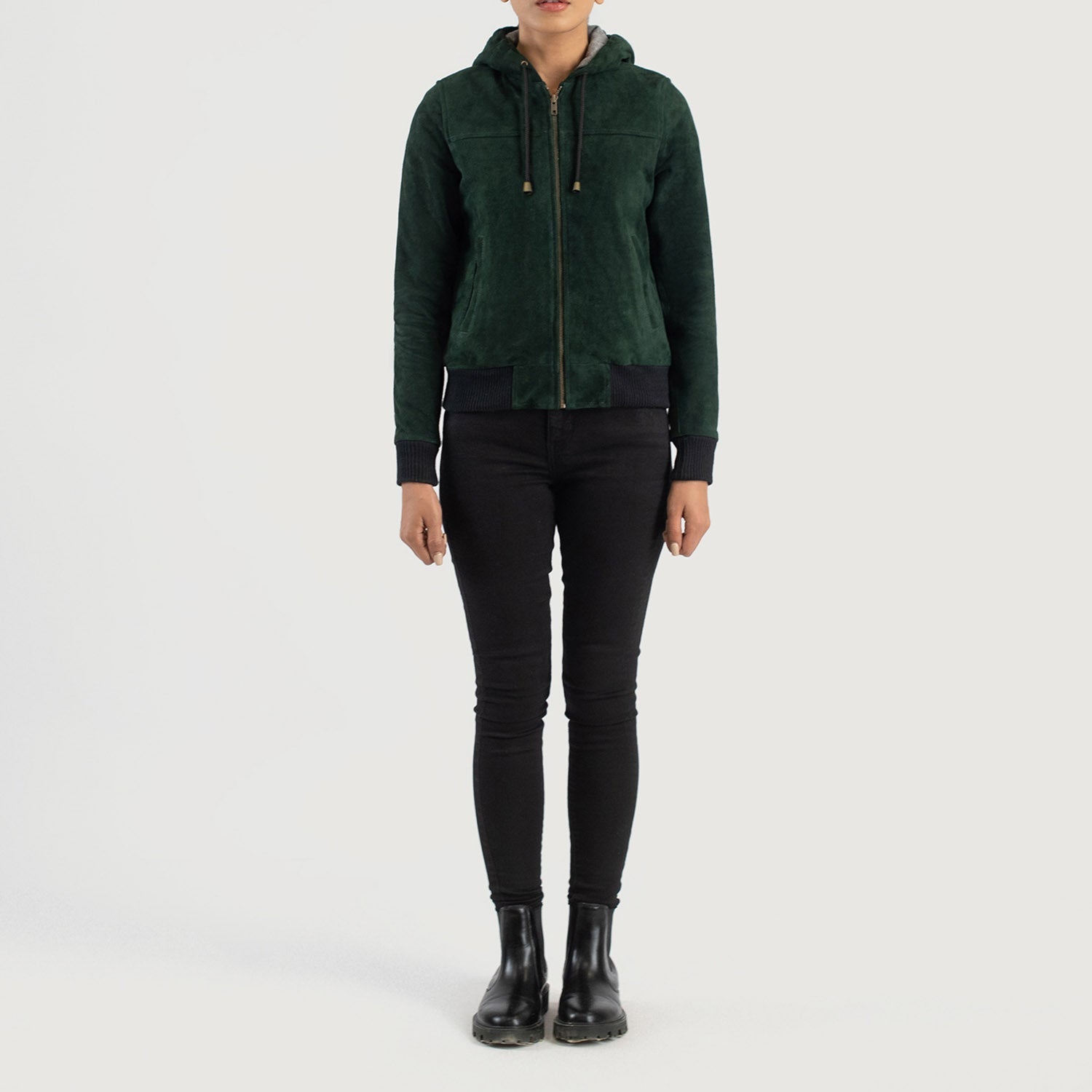 4. Close up of premium green goatskin suede texture on a hooded bomber jacket.