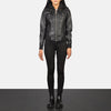 Three quarter profile view of the black leather jacket, highlighting the four functional front pockets and structural athletic silhouette.