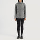 Three quarter profile view of the grey suede shirt jacket, emphasizing its sleek minimalist silhouette and lightweight look.