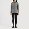 Three quarter profile view of the grey suede shirt jacket, emphasizing its sleek minimalist silhouette and lightweight look.