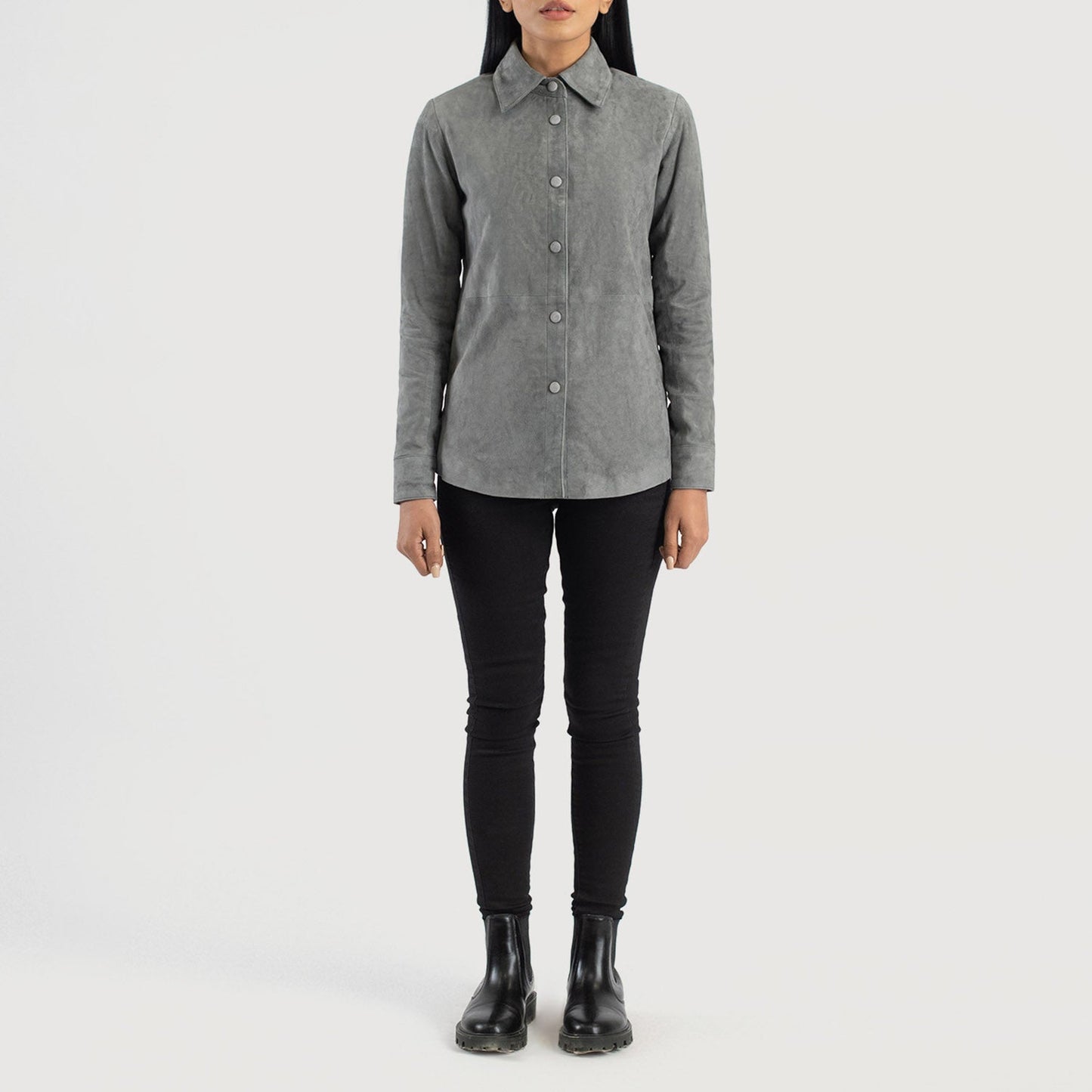 Three quarter profile view of the grey suede shirt jacket, emphasizing its sleek minimalist silhouette and lightweight look.