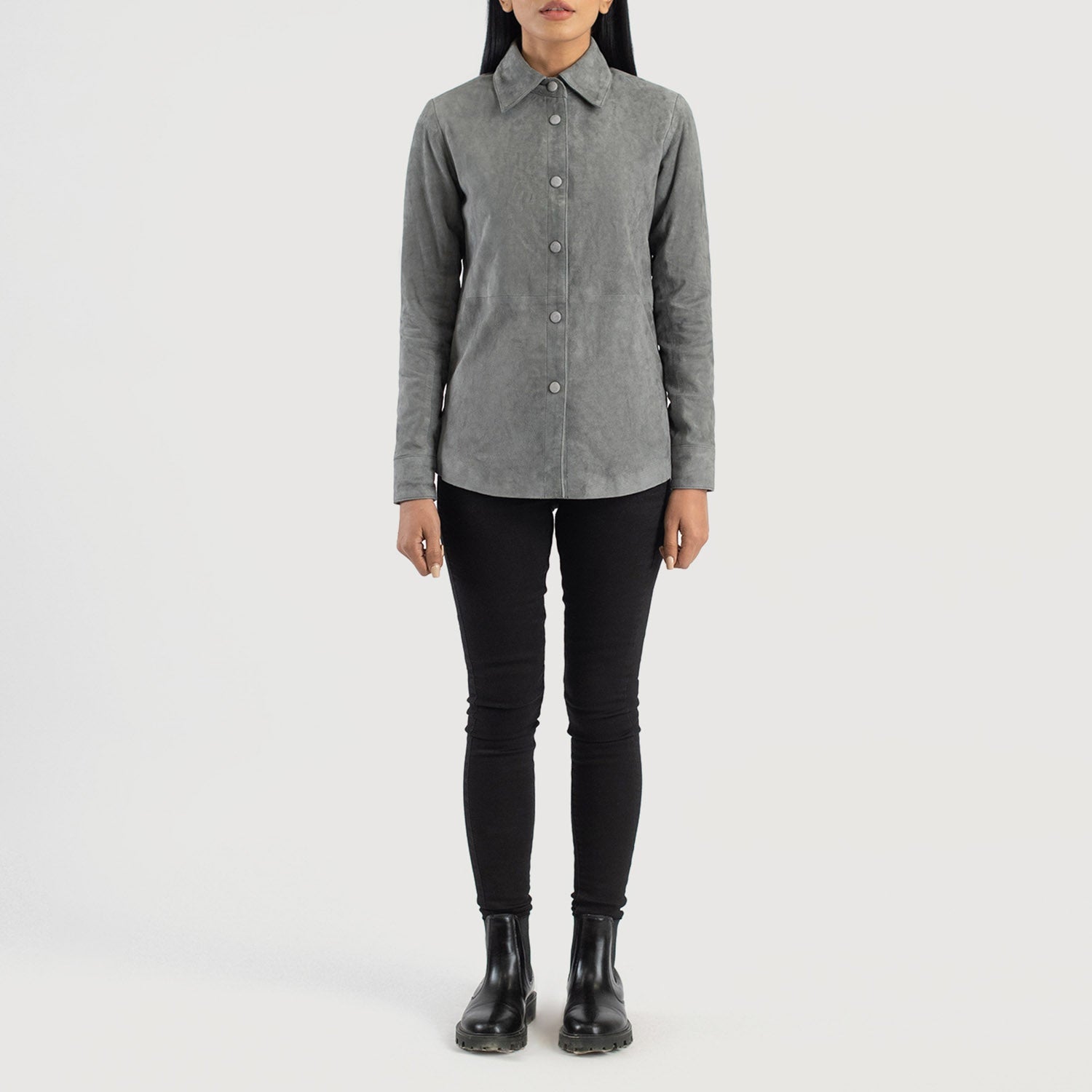 Three quarter profile view of the grey suede shirt jacket, emphasizing its sleek minimalist silhouette and lightweight look.