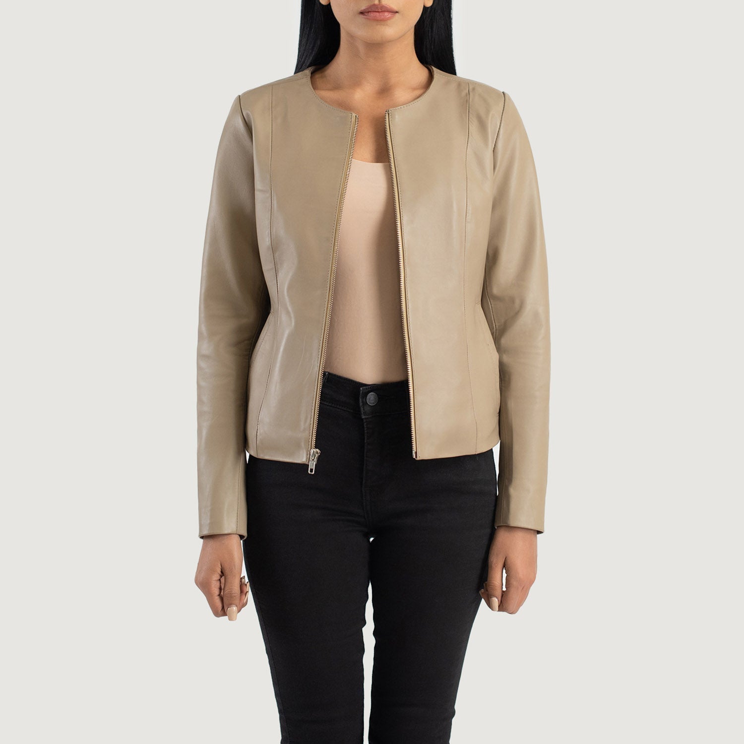 Front view of the Elixir beige leather jacket featuring a modern collarless neckline, central zipper closure, and open hem cuffs.