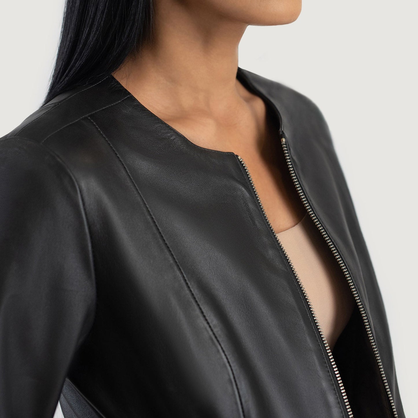 View of the minimalist front closure style on the Elixir leather jacket.