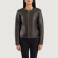 Detailed shot of the clean, raw aesthetic of the collarless neckline and the high quality front zipper hardware.