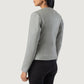 Detailed shot of the clean, raw aesthetic of the collarless neckline and the high quality front zipper hardware.