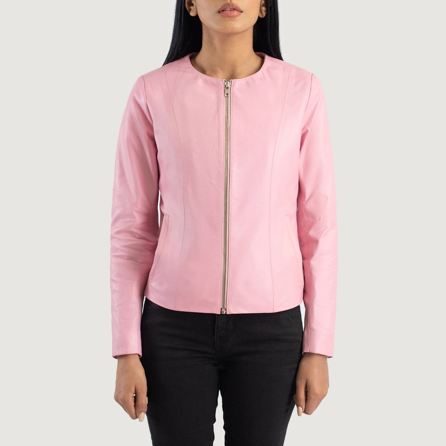 Close up of vibrant pink semi aniline sheepskin leather texture on a collarless jacket.