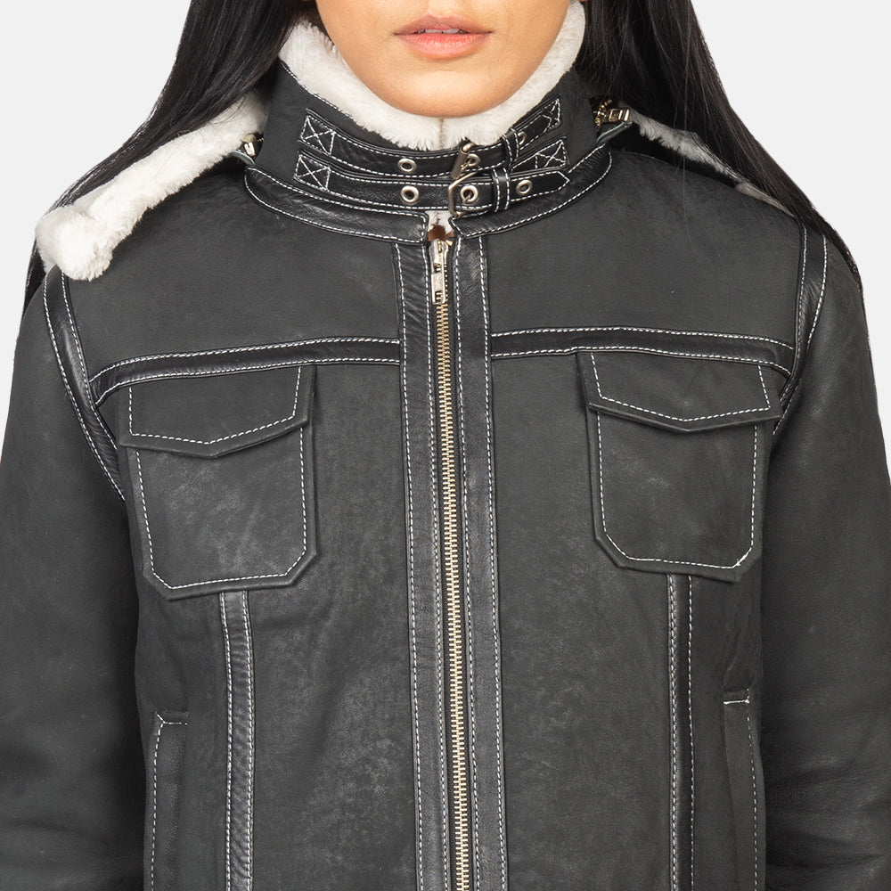 Detail of the removable hood feature on the black shearling leather jacket.