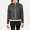 Close up of the four exterior pockets on the front of the black leather jacket.