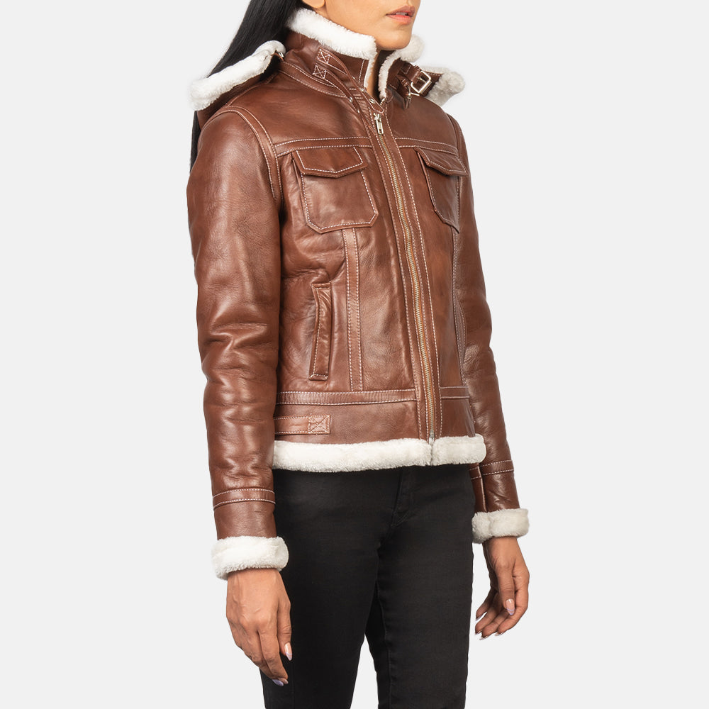 Close up of the high neck collar design featuring belt buckle hardware.