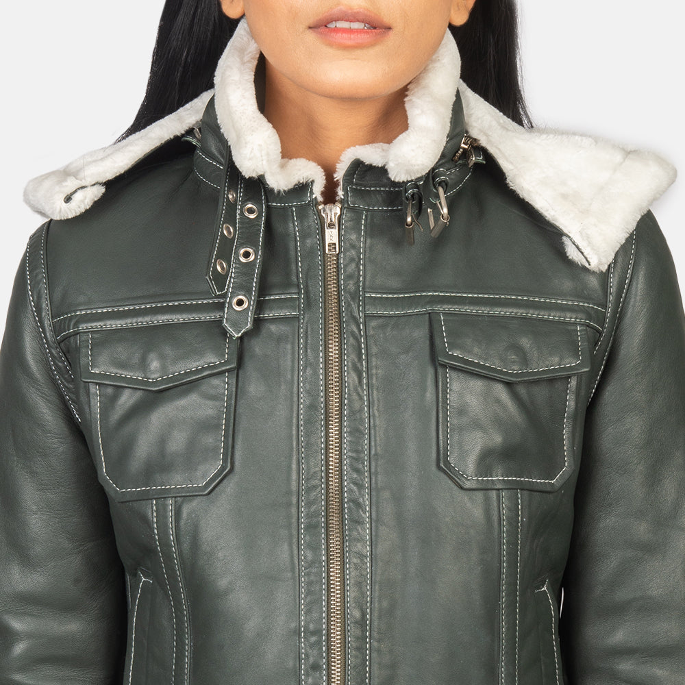 Zoomed-in view of the side waist adjustment straps and one of the four functional front pockets on the green shearling jacket.