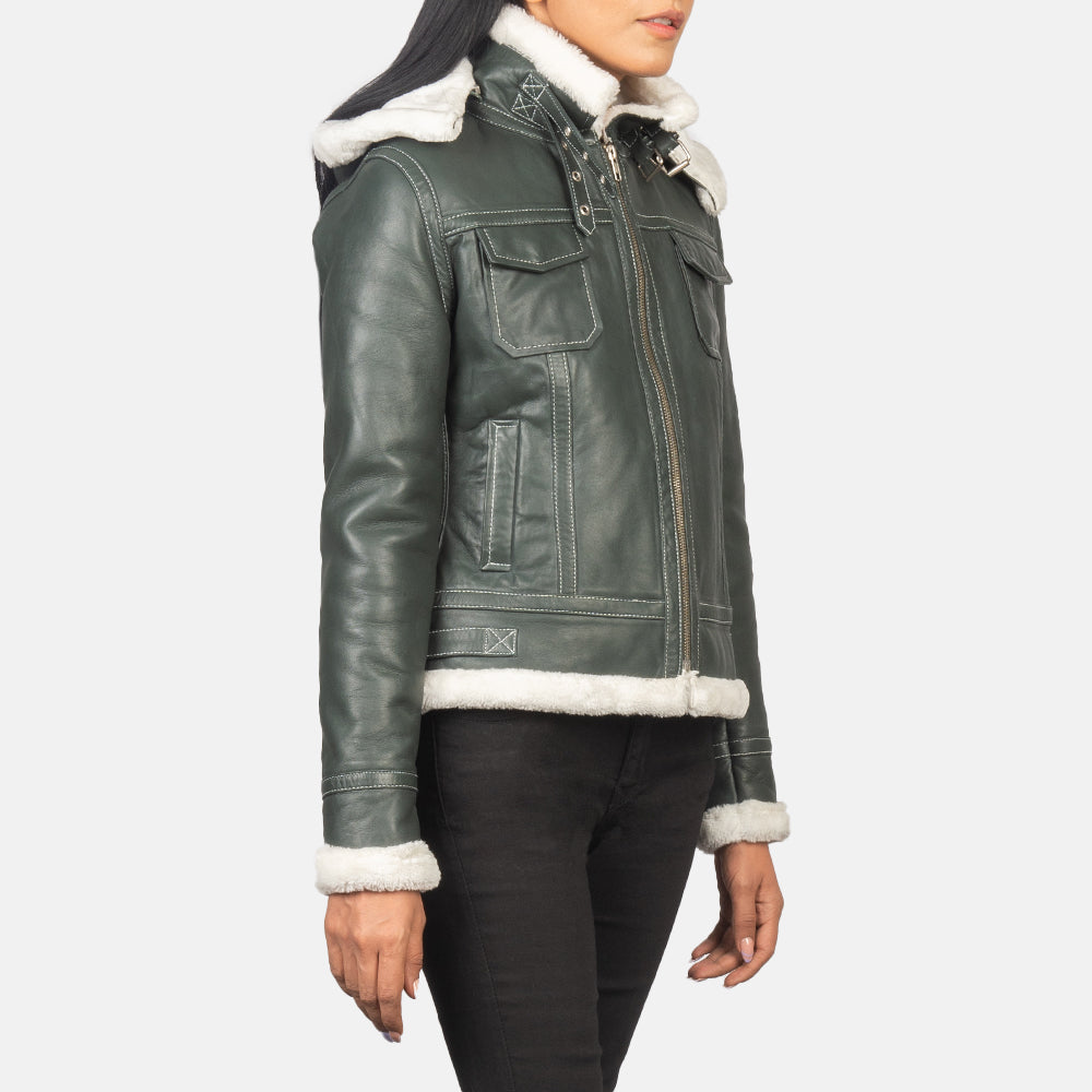 Detailed shot of the green leather jacket showcasing the removable hood feature attached to the high-neck collar.