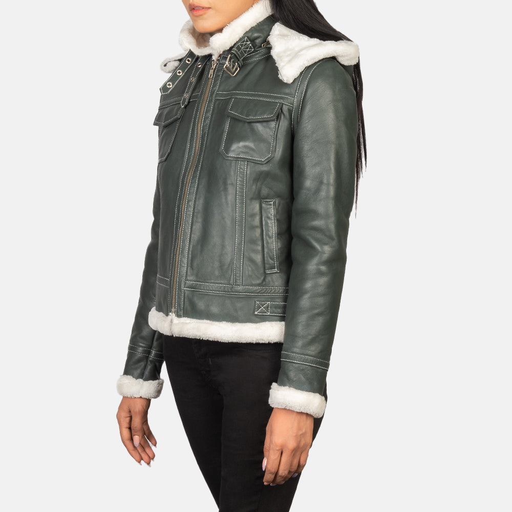 Three-quarter view of the green hooded shearling jacket, highlighting the open hem cuffs and premium semi-aniline finish.