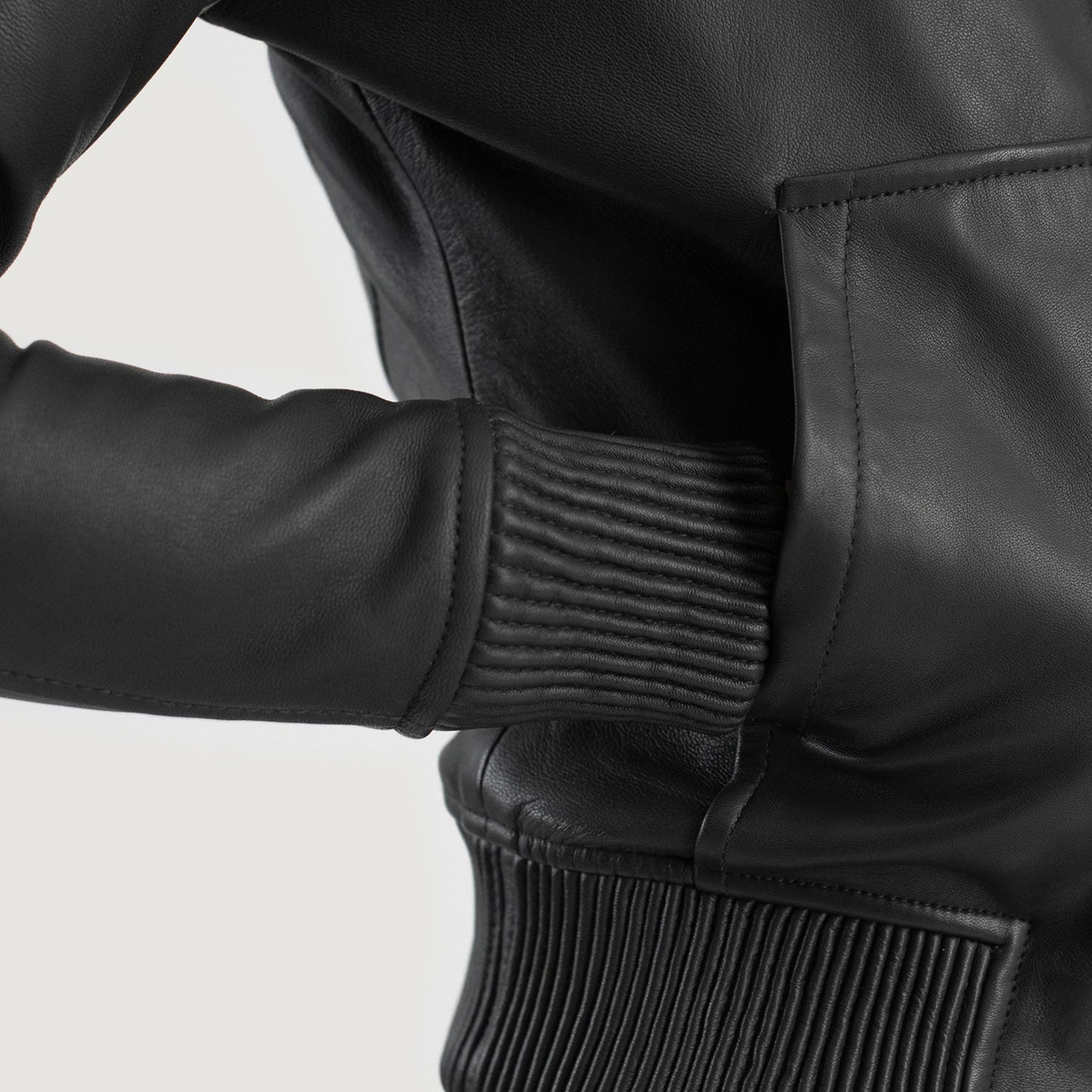 Close up of the attached leather hood and high quality front zipper closure on the black sheepskin jacket.