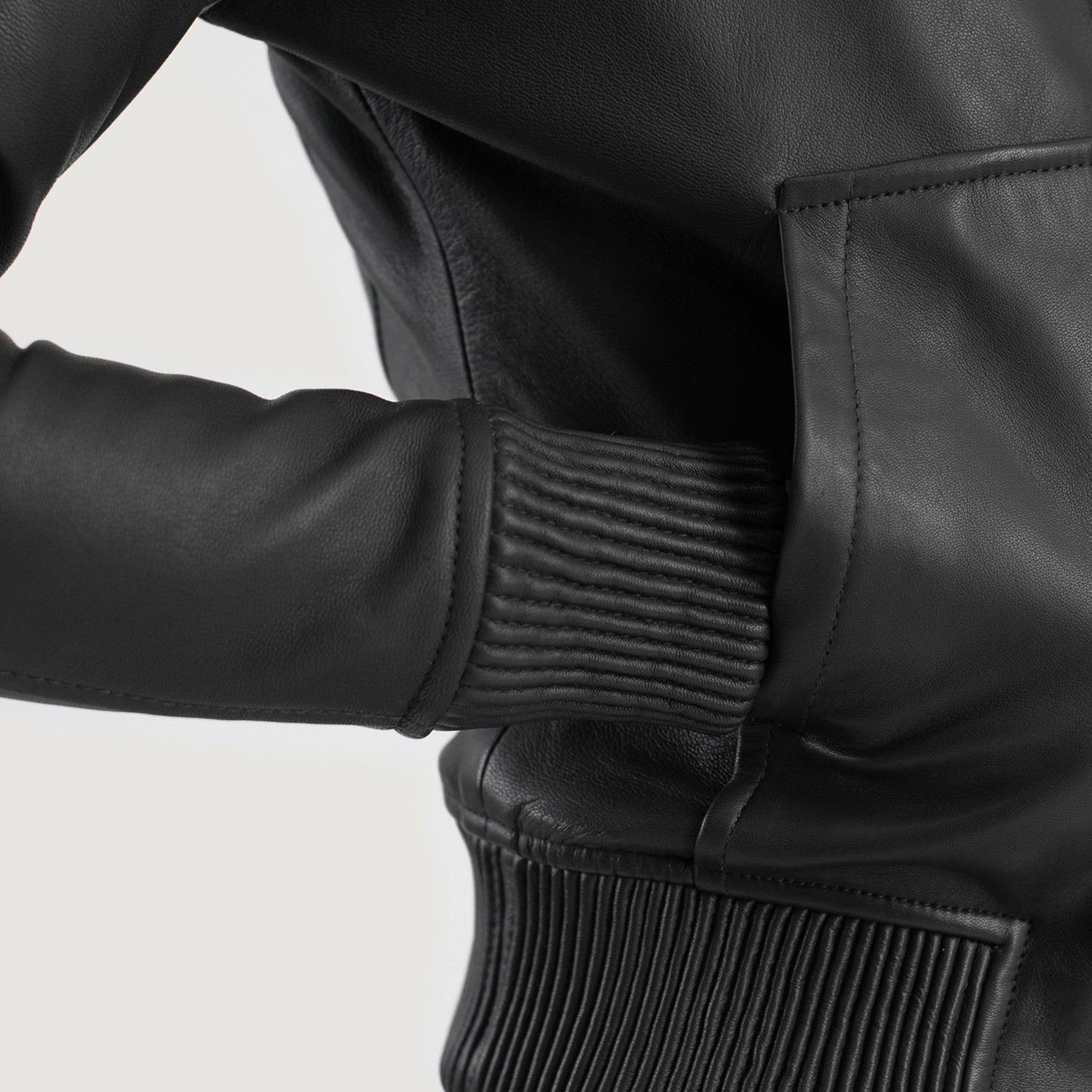 Close up of the attached leather hood and high quality front zipper closure on the black sheepskin jacket.