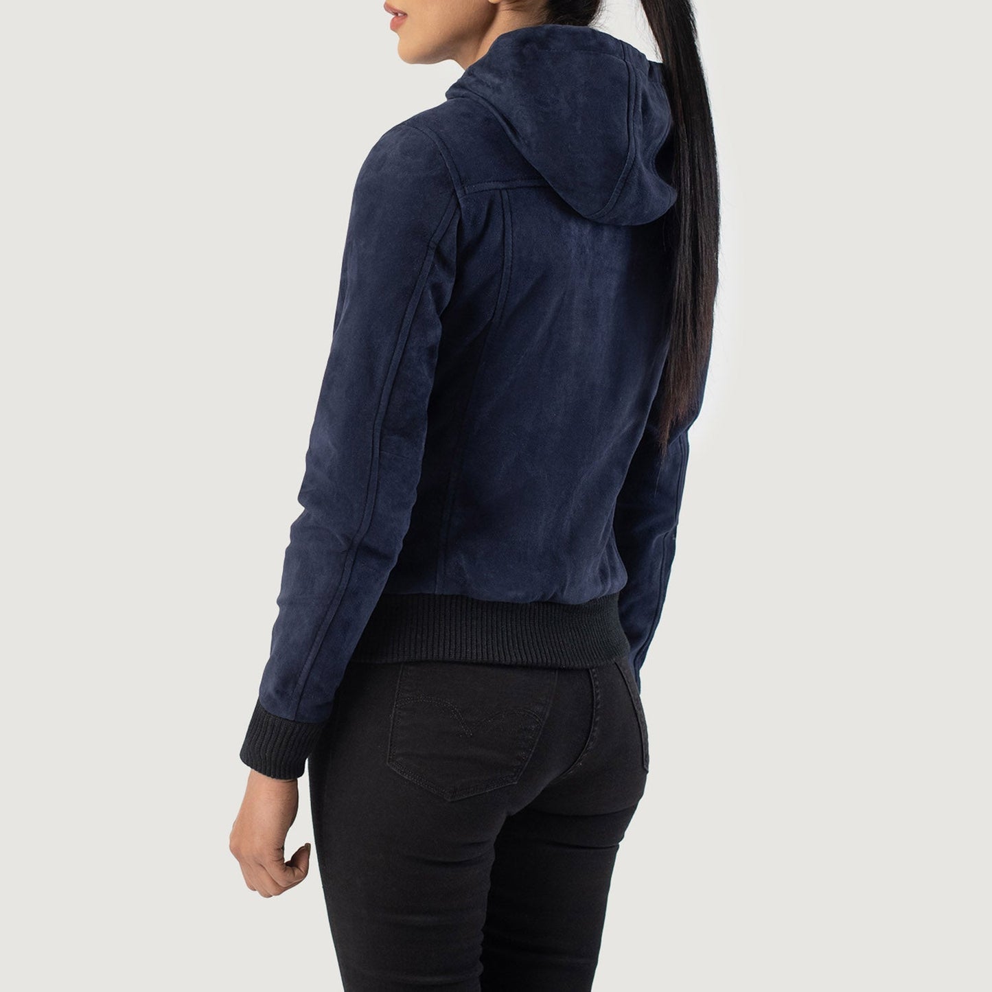 Close-up of the attached suede hood and neckline, showing the neat stitching and front zipper hardware.