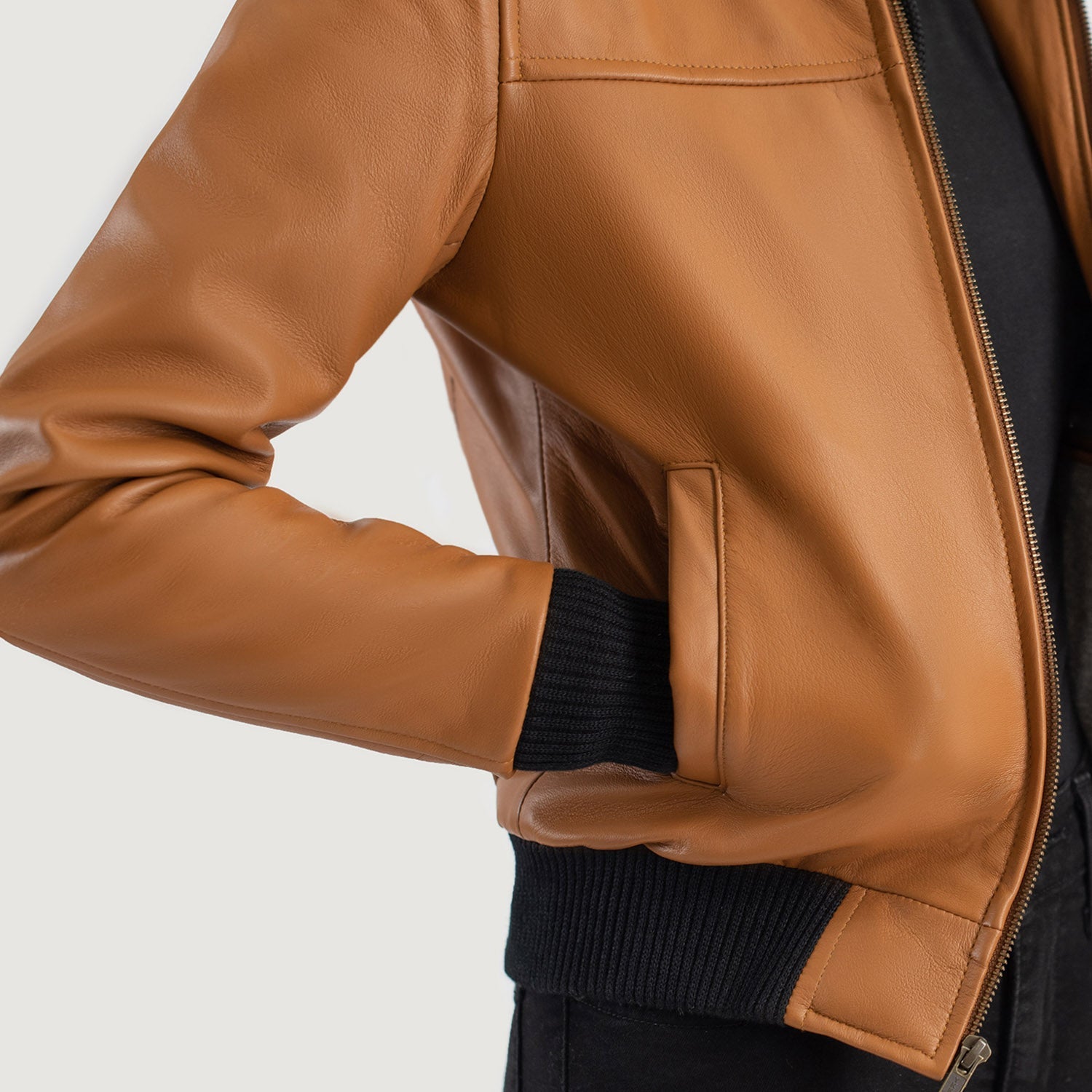  Close up of the sturdy front zipper closure and hardware on the bomber jacket.