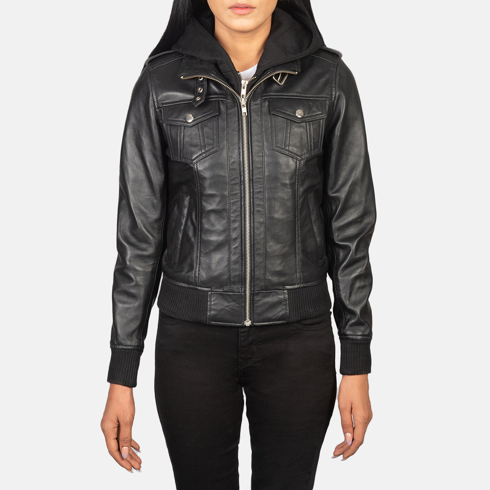 Close up shot of the classic leather shoulder epaulettes with precise stitching on the black sheepskin jacket.