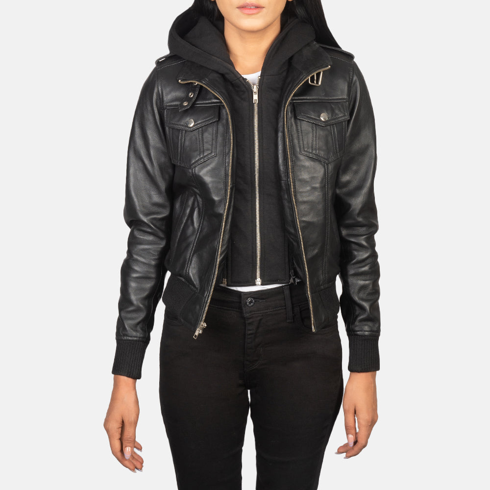 Front view of the Roslyn black sheepskin leather jacket featuring a high neck belted collar, shoulder epaulettes, and a removable fabric hood.