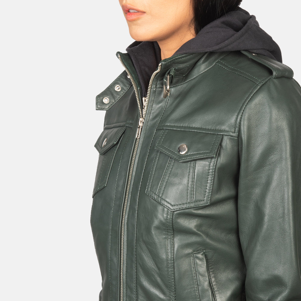 Detailed view of the snug rib-knit cuffs and the dual chest and waist utility pockets on the front of the jacket.