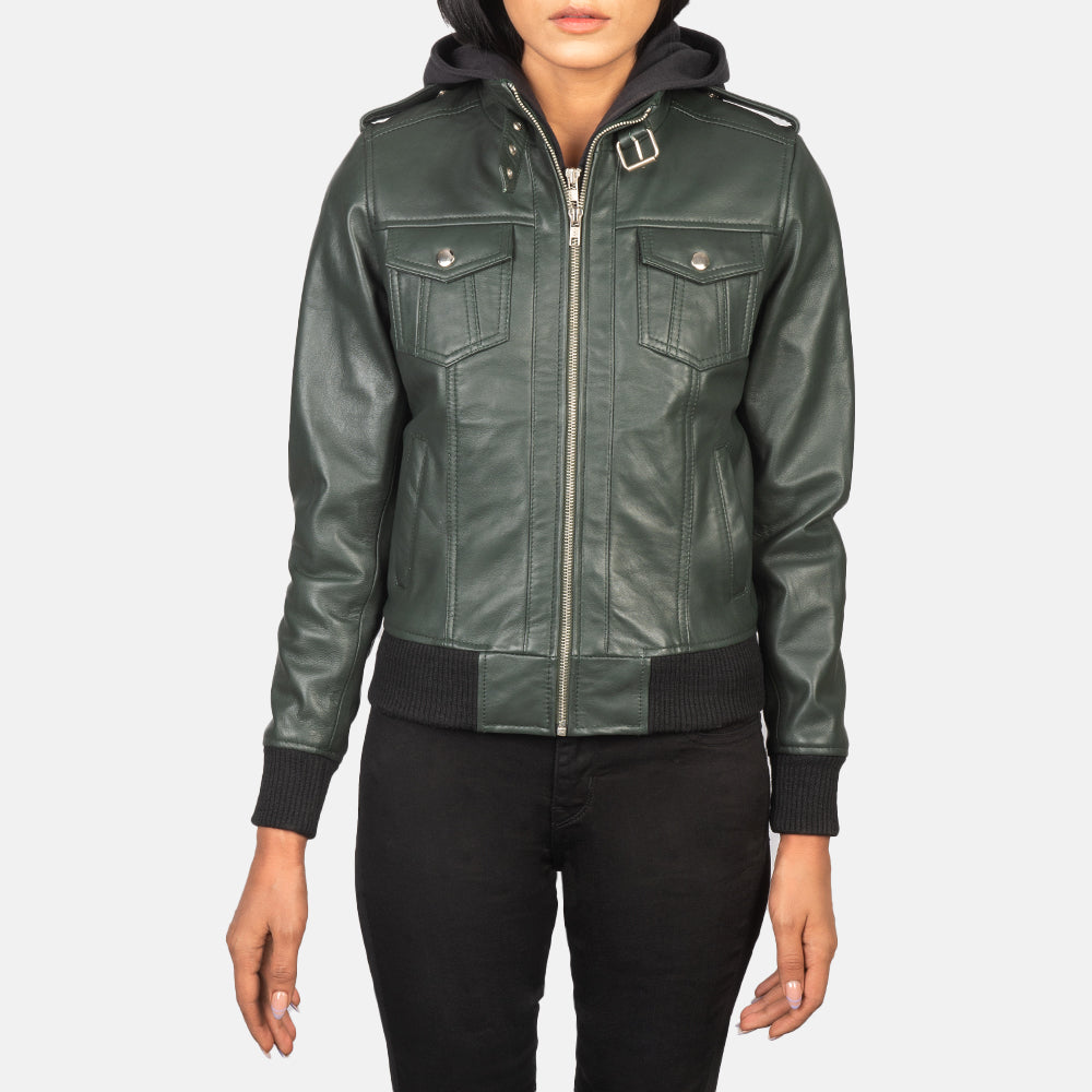 Close-up shot of the classic leather shoulder epaulettes with precise stitching on the green sheepskin jacket.