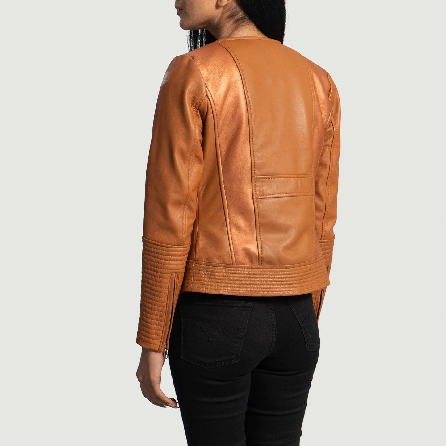 Full side profile of the Sleeky Clean tan leather jacket showcasing a modern fit.