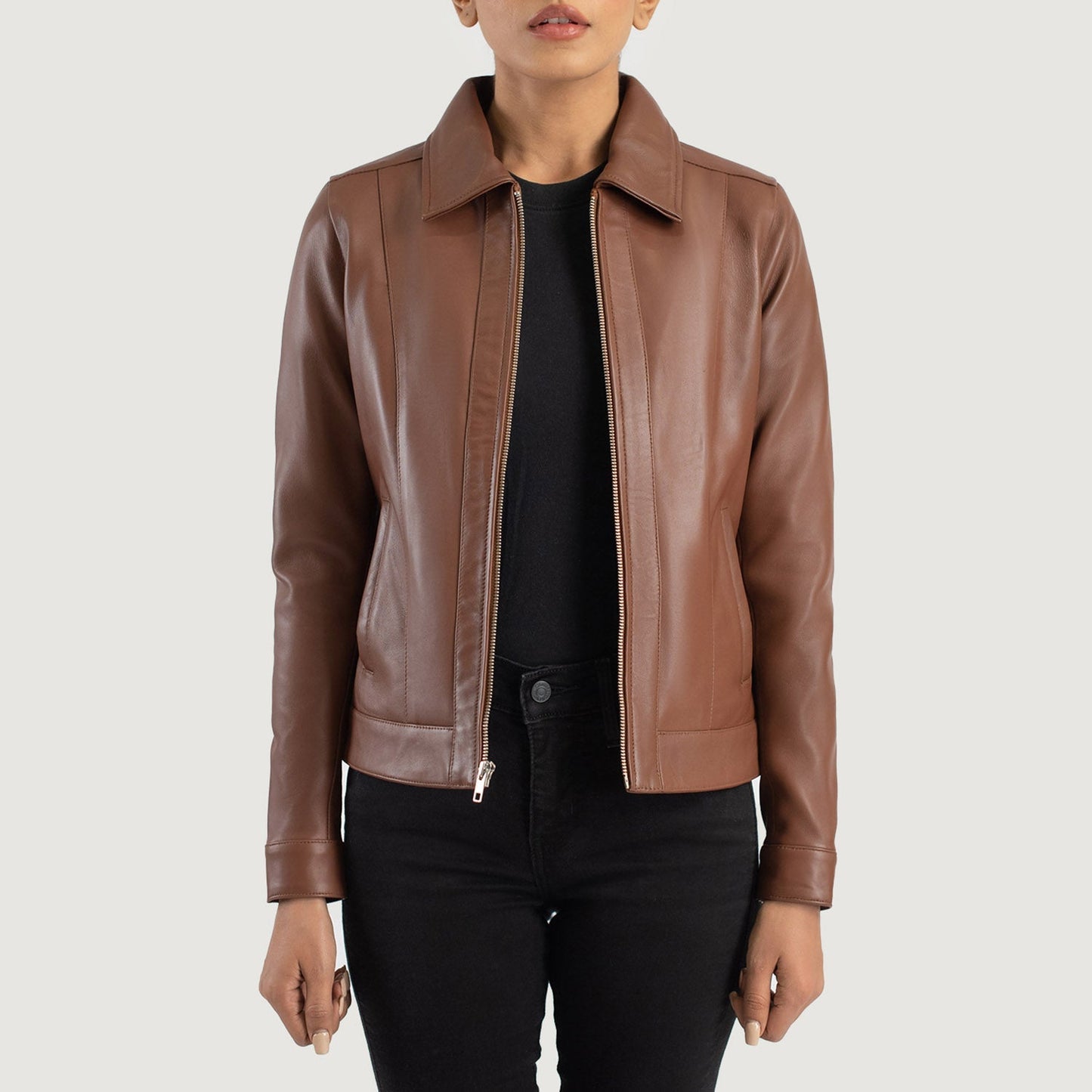 Front view of the Vixen brown leather jacket featuring a classic shirt style collar, central zipper closure, and structured waist pockets.
