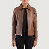 Front view of the Vixen brown leather jacket featuring a classic shirt style collar, central zipper closure, and structured waist pockets.