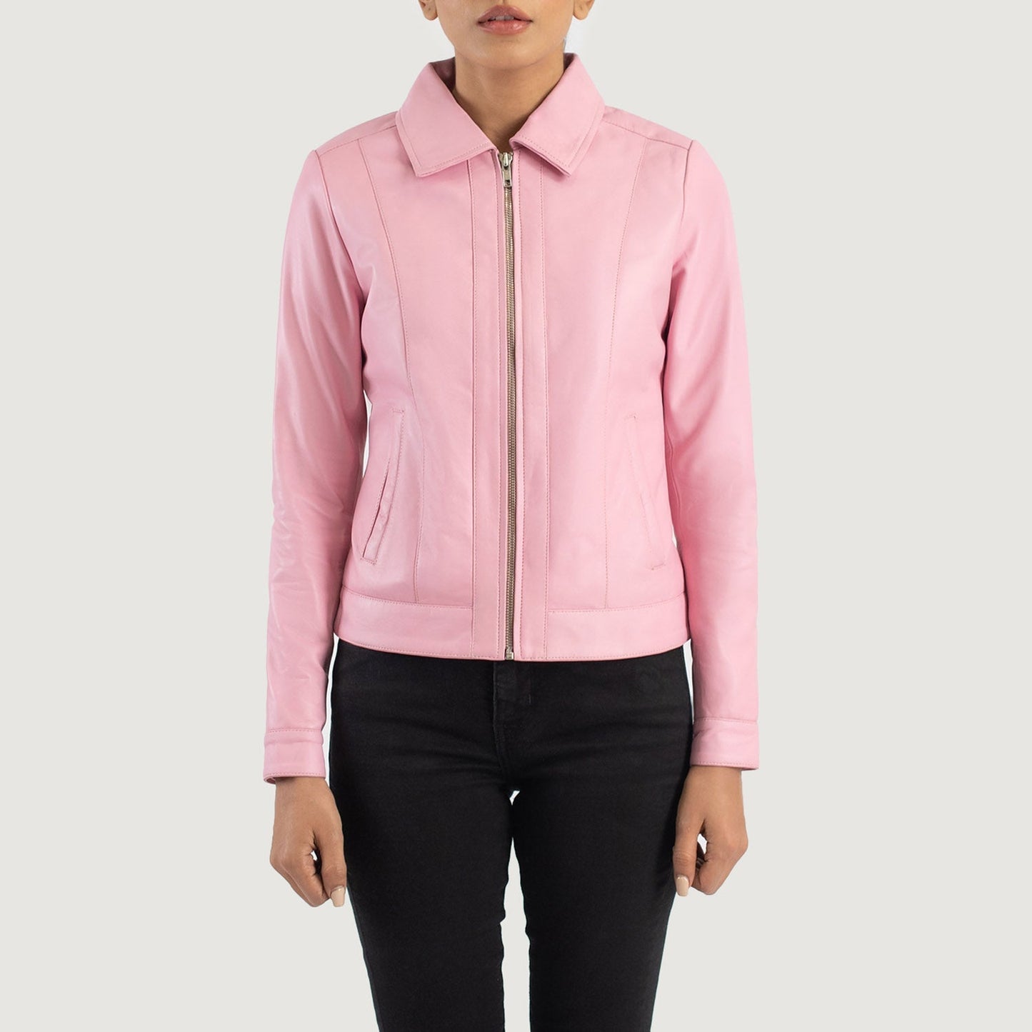 Detailed shot of the crisp shirt style leather collar and the heavy duty front zipper closure on the pink jacket.