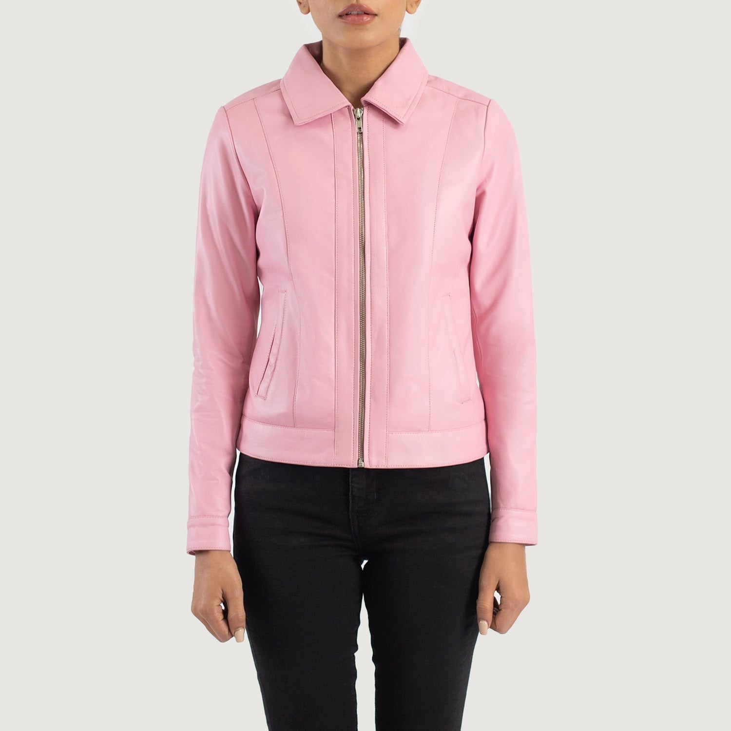 Detailed shot of the crisp shirt style leather collar and the heavy duty front zipper closure on the pink jacket.