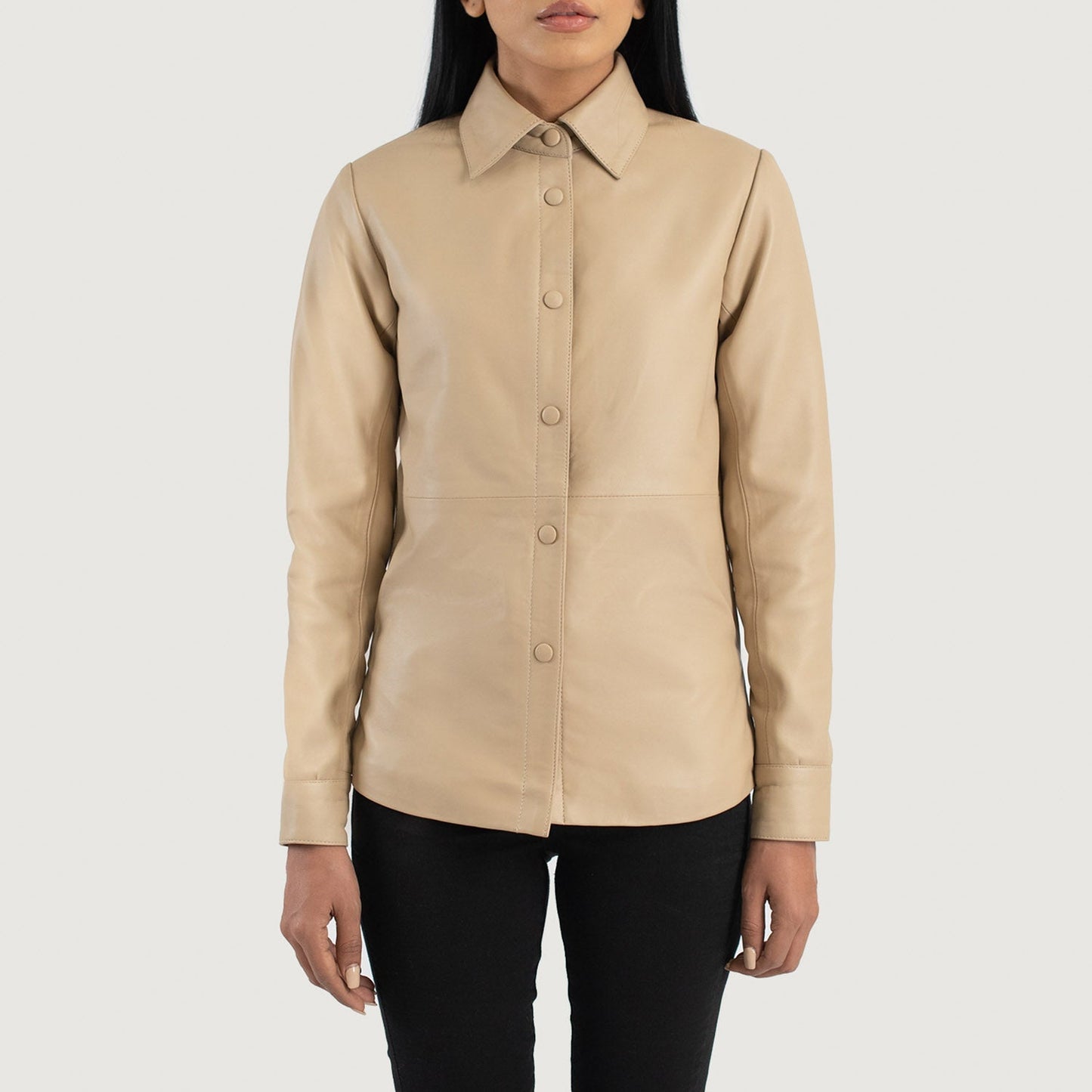 Detailed shot of the premium matching beige leather buttons stitched along the front placket of the jacket.