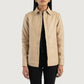 Front view of the Zenith beige leather shirt jacket showcasing its clean pocketless design and front leather button closures.