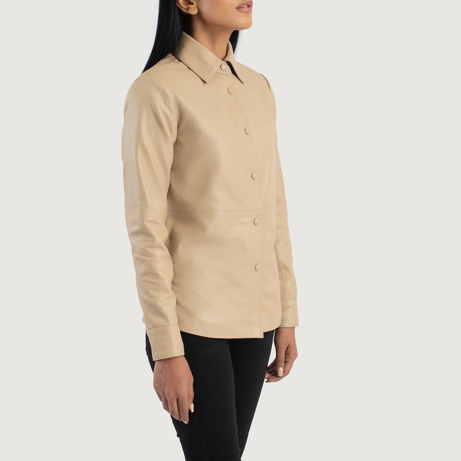 Full back view of the beige sheepskin leather shirt jacket, highlighting the smooth, uninterrupted drape and tailored paneling.